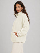 YUCOLEN Women's Stretchy Half Zip Fuzzy Sherpa Pullover with Kangaroo Pocket in Beige
