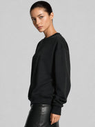 YUCOLEN Women's Fleece Lined Crewneck Sweatshirt with Thumb Holes Loose Fit Pullover in Black