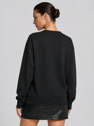 YUCOLEN Women's Fleece Lined Crewneck Sweatshirt with Thumb Holes Loose Fit Pullover in Black
