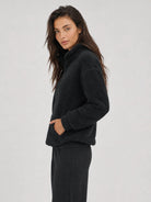 YUCOLEN Women's Stretchy Half Zip Fuzzy Sherpa Pullover with Kangaroo Pocket in Black