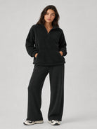 YUCOLEN Women's Stretchy Half Zip Fuzzy Sherpa Pullover with Kangaroo Pocket in Black
