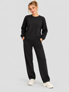 YUCOLEN Womens Warm Fleece Crewneck Sweatshirt with Zip Pockets in Black