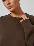YUCOLEN Women's Fleece Lined Crewneck Sweatshirt with Thumb Holes Loose Fit Pullover in Dark Brown