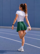YUCOLEN Women High Waisted Pleated Tennis Skort - Pickleball Golf Skirt with Pockets in Emerald Green