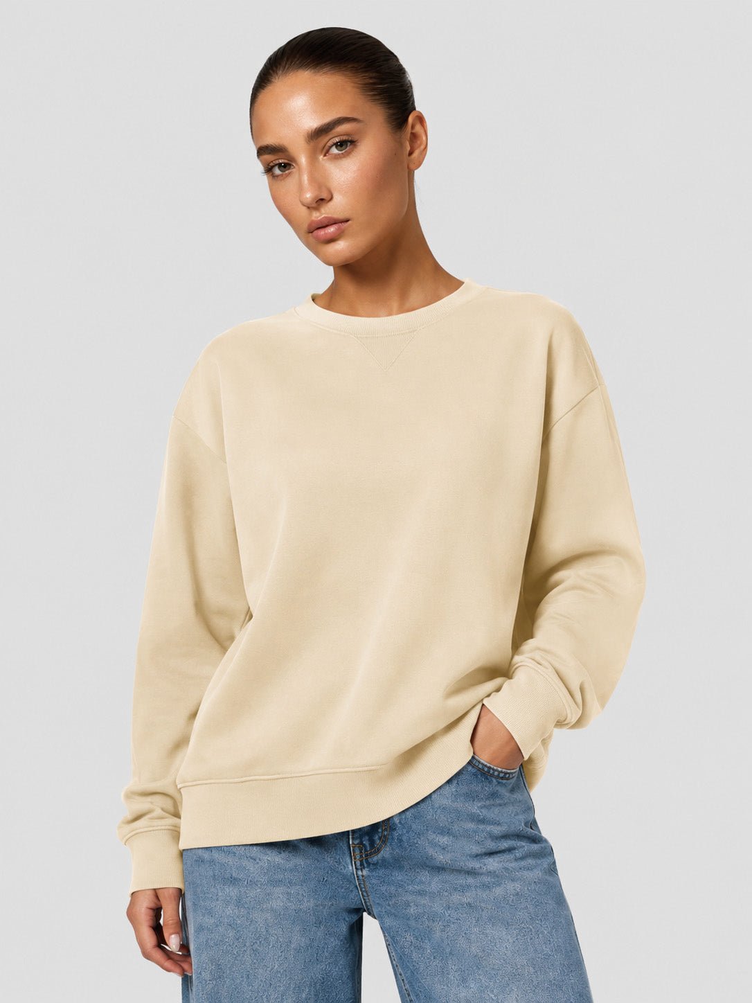 YUCOLEN Women's Fleece Lined Crewneck Sweatshirt with Thumb Holes Loose Fit Pullover in Light Apricot