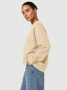 YUCOLEN Women's Fleece Lined Crewneck Sweatshirt with Thumb Holes Loose Fit Pullover in Light Apricot