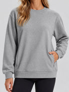 YUCOLEN Womens Warm Fleece Crewneck Sweatshirt with Zip Pockets in Light Grey