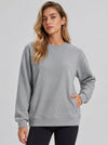 YUCOLEN Womens Warm Fleece Crewneck Sweatshirt with Zip Pockets in Light Grey