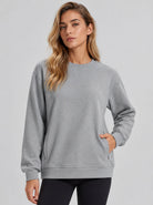 YUCOLEN Womens Warm Fleece Crewneck Sweatshirt with Zip Pockets in Light Grey