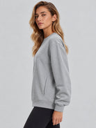 YUCOLEN Womens Warm Fleece Crewneck Sweatshirt with Zip Pockets in Light Grey