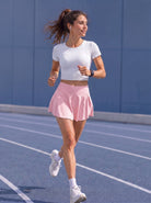 YUCOLEN Women High Waisted Pleated Tennis Skort - Pickleball Golf Skirt with Pockets in Light Pink