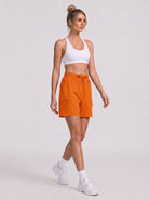 YUCOLEN Women's Quick Dry Hiking Cargo Shorts UPF 50 Plus Lightweight 5 Inch Athletic Shorts in Orange