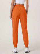 YUCOLEN Women's Lightweight Quick Dry Hiking Pants Water Resistant Outdoor Joggers in Orange