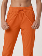 YUCOLEN Women's Lightweight Quick Dry Hiking Pants Water Resistant Outdoor Joggers in Orange
